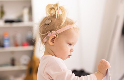 Young child with a cochlear implant